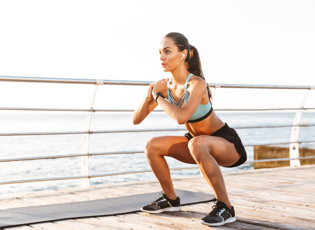 woman squats warm-up exercises